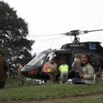 nepalese children outside black helicopter