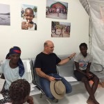 richard hotes and haitian natives in clinic