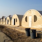 line of tan round tents
