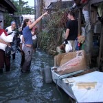 hotes volunteers in flooded alley